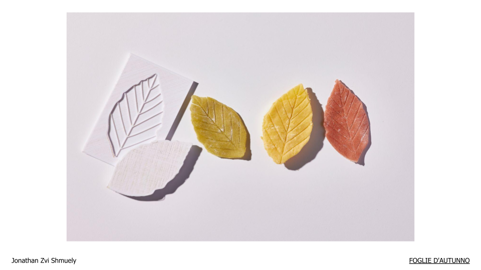 Leaf-shaped pasta pieces next to a leaf mould