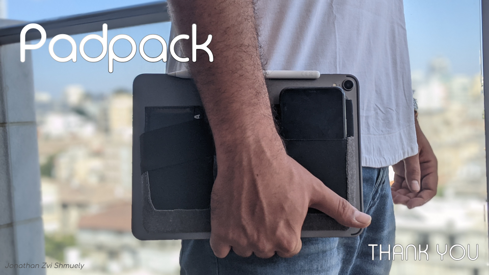 Padpack carried on a tablet in front of a city view