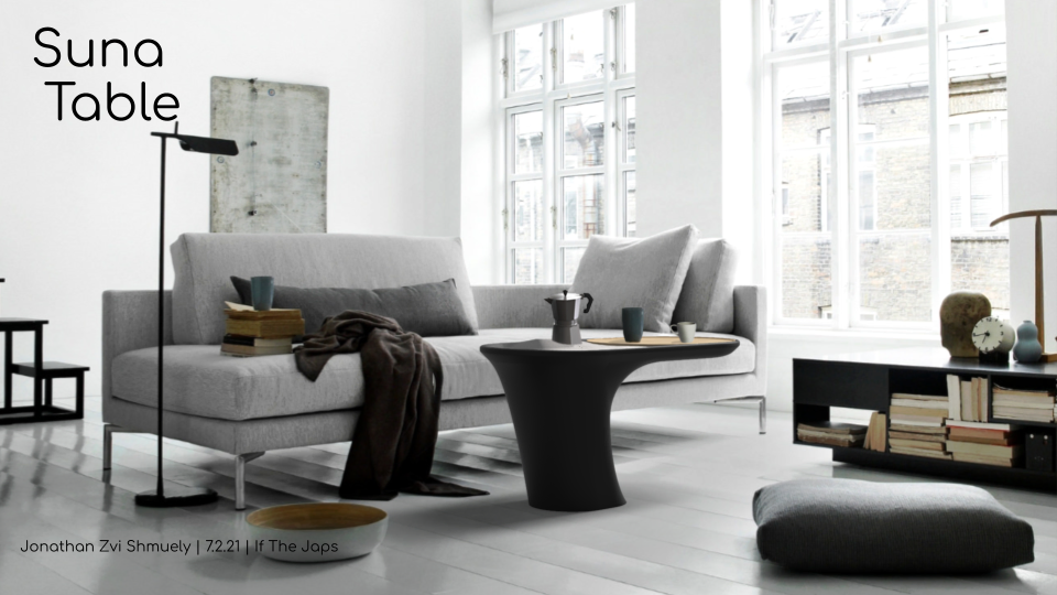 Suna coffee table in a bright living room next to a grey sofa